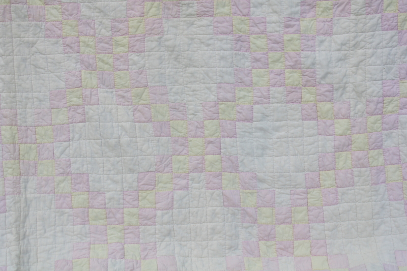 soft faded vintage hand stitched cotton quilt, patchwork blocks pink, butter yellow, white