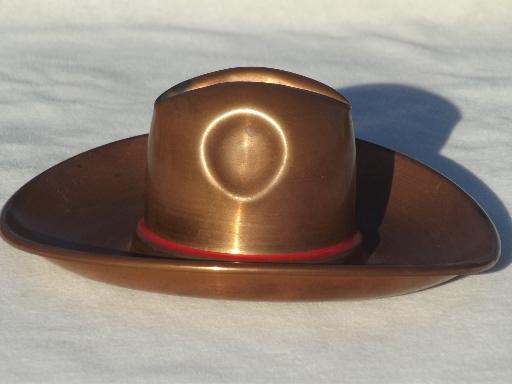 solid copper cowboy hats, vintage metal art sculpture pieces or ashtrays