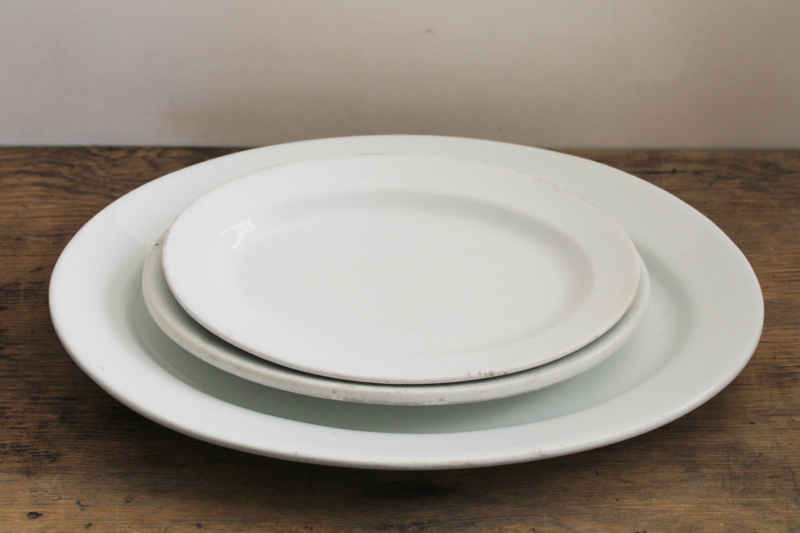 stack of antique white ironstone platters, vintage farmhouse kitchen serving ware