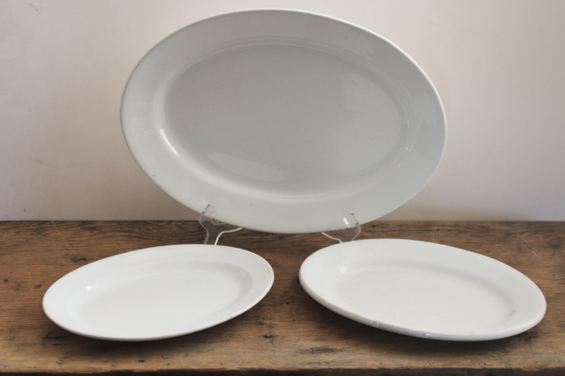 stack of antique white ironstone platters, vintage farmhouse kitchen serving ware