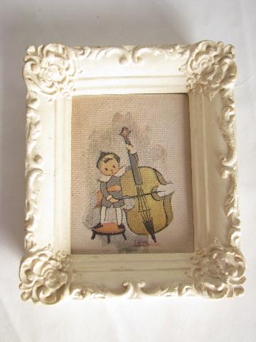 tiny vintage prints in chalkware plaster frames, the Wee Musicians