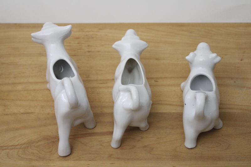 trio of ceramic cow creamers, plain white ironstone cream pitchers, french country modern farmhouse