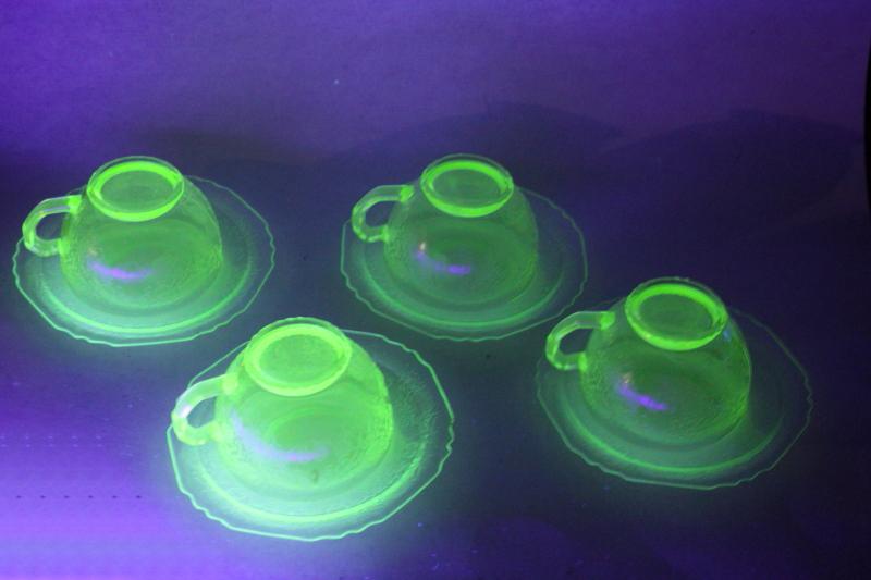 uranium glow green depression glass tea cups and saucers 1930s vintage Hazel Atlas glassware