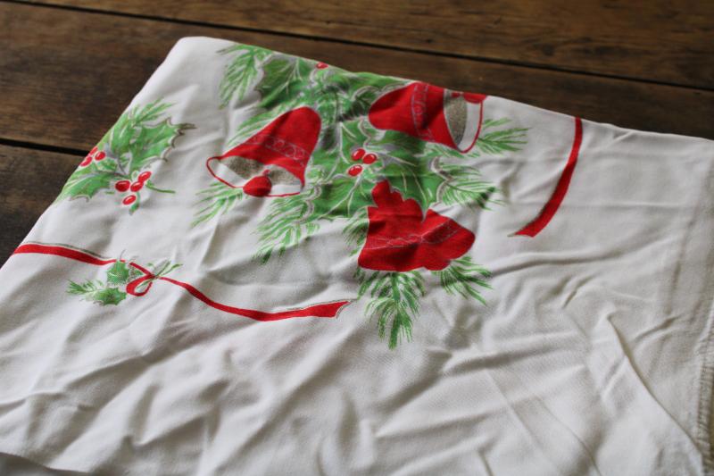 vintage Christmas print tablecloth, rayon fabric w/ bells, candles, holly, poinsettias