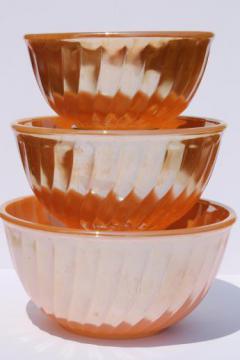 vintage Fire-King peach luster glass mixing bowl nest, nesting swirl bowls