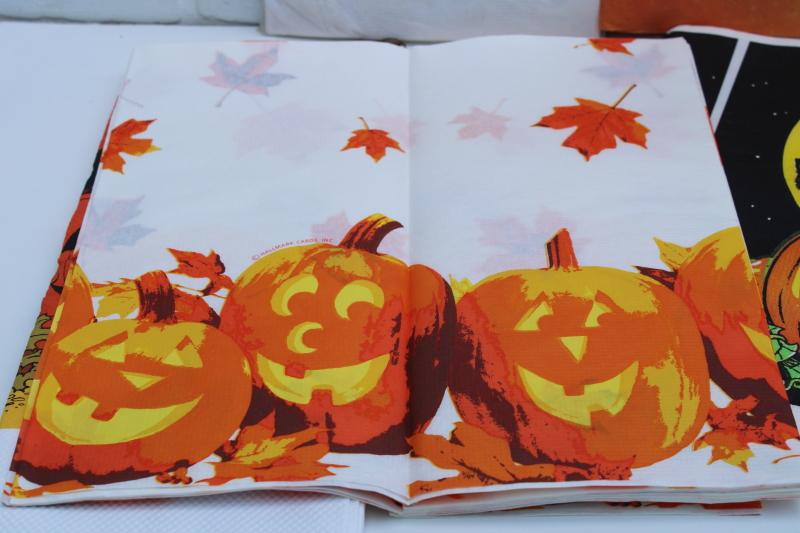 vintage Halloween party tablecloths, orange crepe paper w/ black cat, white paper table covers w/ print borders