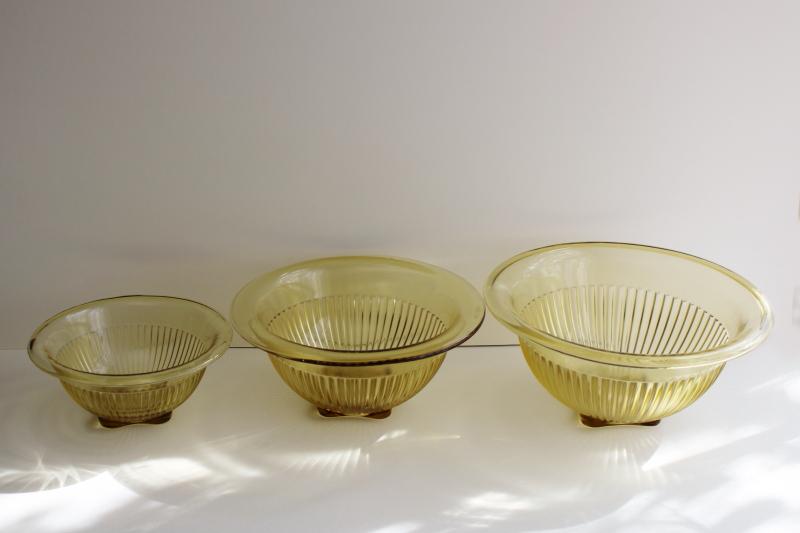 vintage Hazel Atlas glass nest of mixing bowls, amber yellow depression glass