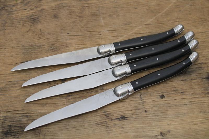 vintage Laguiole France steak knives set of four, black plastic handles w/ bee