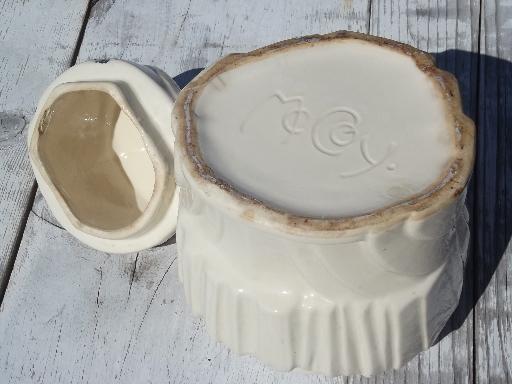 vintage McCoy pottery cookie jar, white glaze clown w/ handpainted face