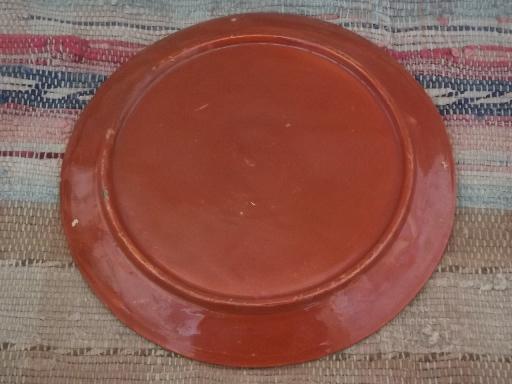 vintage Tlaquepaque Mexican painted pottery plates, one black, one red