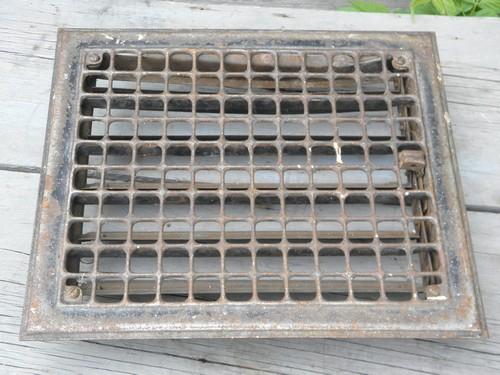 vintage architectural iron hardware, old floor or wall register grate