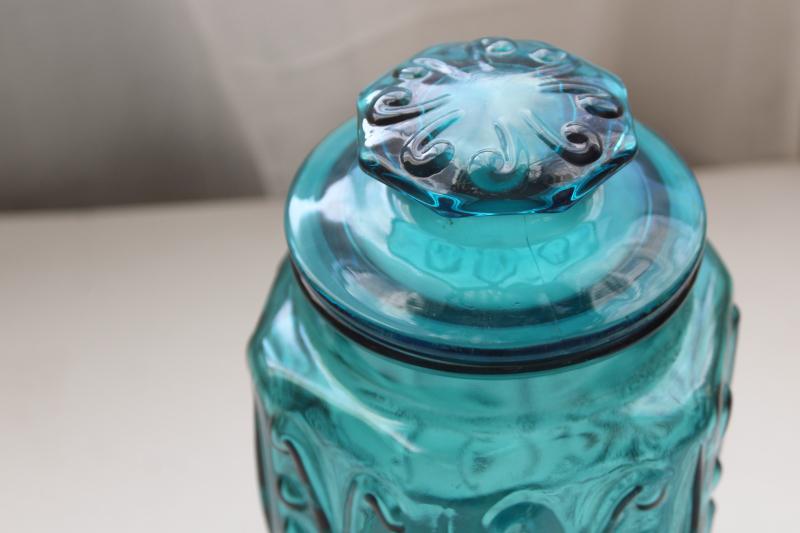 vintage blue glass canister jar, scroll pattern aqua or teal colored glass