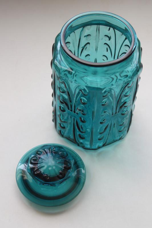 vintage blue glass canister jar, scroll pattern aqua or teal colored glass