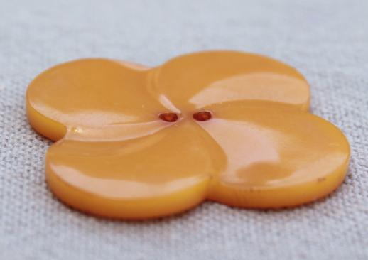 vintage butterscotch bakelite button, large clover leaf flower shape charm or jewelry button