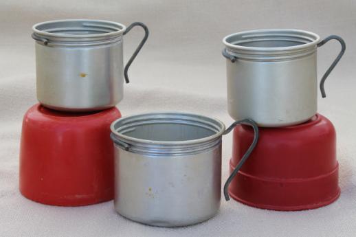 vintage camping cups, red bakelite or early plastic Aladdin thermos caps & aluminum mugs