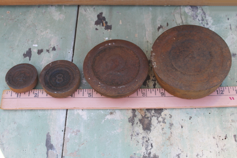 vintage cast iron scale weights, antique numbered graduated rounds