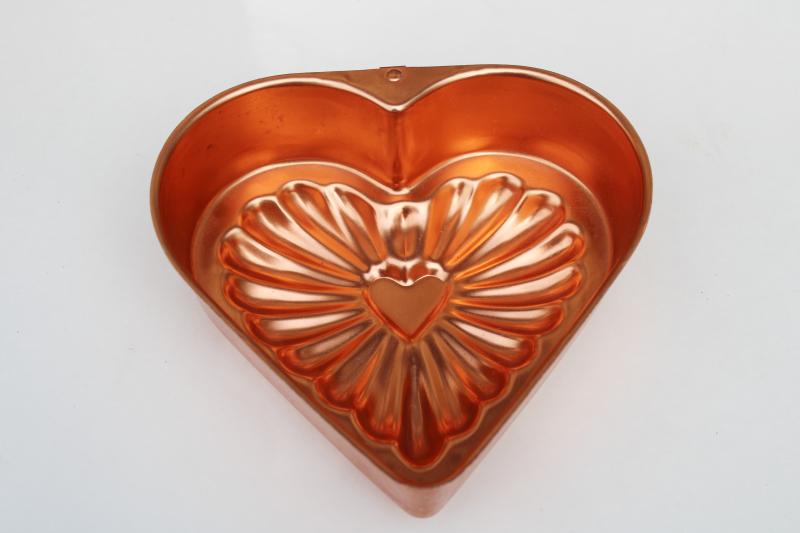vintage copper colored aluminum heart shaped jello mold or cake pan, kitchen wall hanging