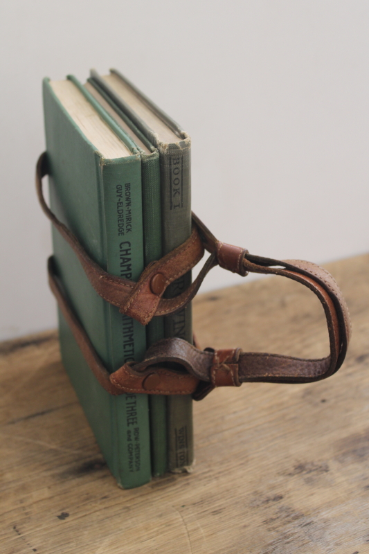 vintage early reader school books w/ green covers in old antique leather strap satchel