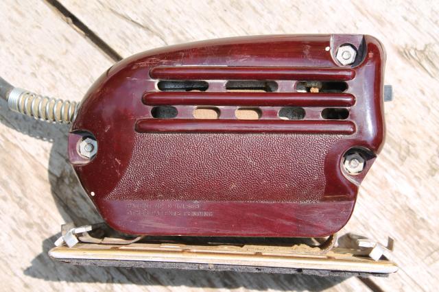 vintage electric palm sander, 1950s red bakelite woodworking power tool