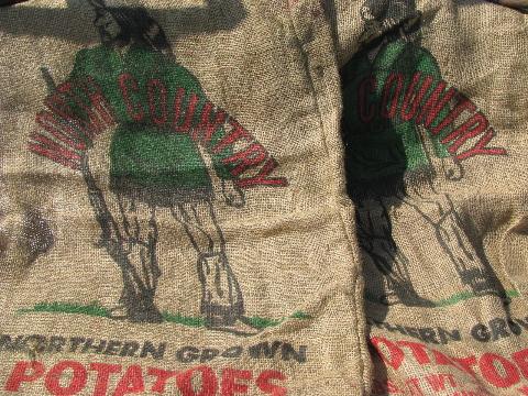 vintage farm primitive burlap potato bags w/ bright advertising graphics, 50 lb sacks