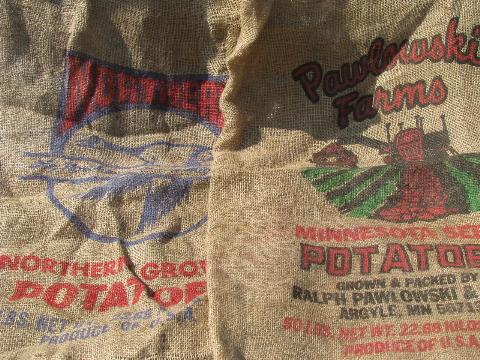 vintage farm primitive burlap potato bags w/ bright advertising graphics, 50 lb sacks