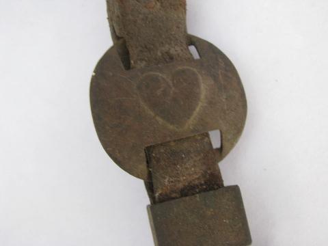 vintage farm primitive hook, old heart horse brasses, antique brass medallions on strap