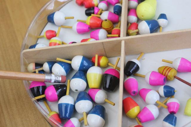 vintage fishing tackle, unused mini fishing bobbers floats in neon colors