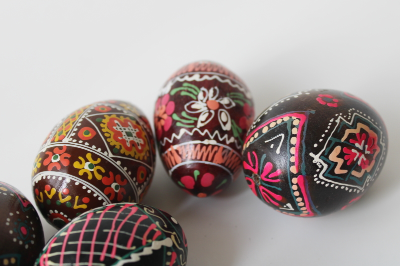 vintage folk art, hand painted wooden Easter eggs, dark brown  black w/ bright colors