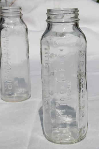 vintage glass baby bottles, lot of four 8 oz Evenflo nursing bottles 
