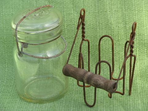vintage glass bail lid fruit jar in old wirework carrier rack w/ wood handle