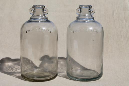 vintage glass jugs, primitive half gallon jug bottles w/ ears for bail handles