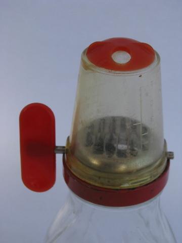 vintage hand-crank nut grinder, 1950s red plastic w/ glass jar, old kitchen utensil
