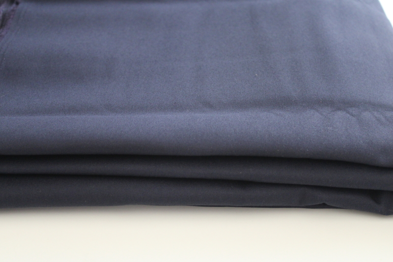 vintage heavy cotton twill fabric, uniform or workwear / outerwear weight, navy blue