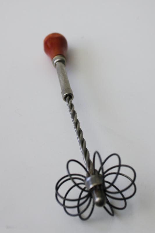 vintage kitchen whisk or eggbeater, patent spring loaded push design looped wire whip