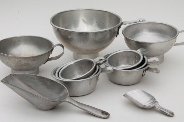 https://laurelleaffarm.com/item-photos/vintage-kitchenware-lot-aluminum-metal-measuring-cups-scoops-funnels-Laurel-Leaf-Farm-item-no-nt72218-1.jpg