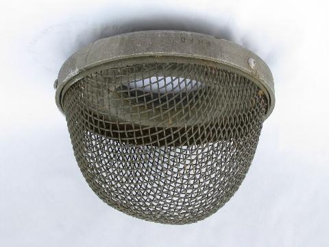vintage old protective wire cage, industrial lighting