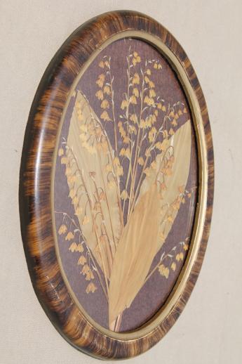 vintage pressed flower picture, collage of dried flowers, lilies of the valley in oval frame