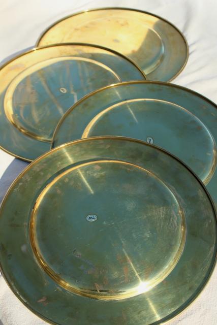 vintage set of four gold charger plates, very heavy solid brass chargers