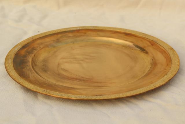 vintage set of four gold charger plates, very heavy solid brass chargers