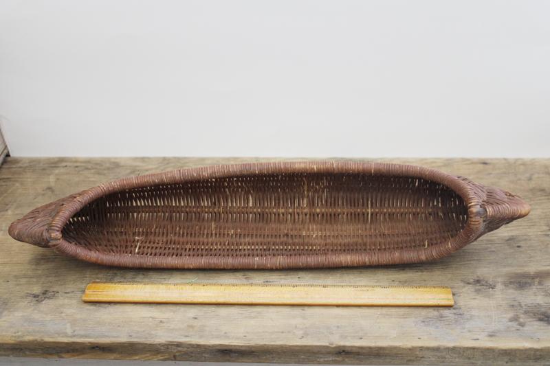 vintage wicker basket, rustic camp souvenir style large hand woven canoe shape