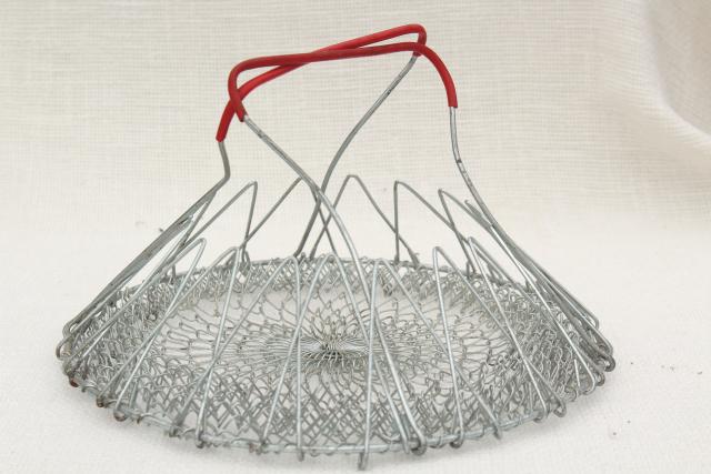 vintage wire basket full of old metal cookie cutters, country farmhouse kitchenware