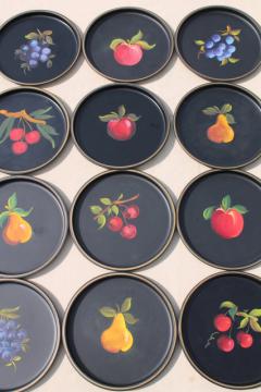 catalog photo of 12 small round metal trays, vintage tole painted tray set w/ fruit designs on black