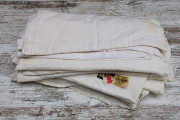 catalog photo of 12 vintage cotton flour sack towels w/ original labels, unused but spotted 