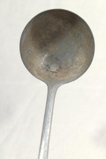 photo of 1920s vintage cast aluminum dipper or soup ladle, marked Germany #7