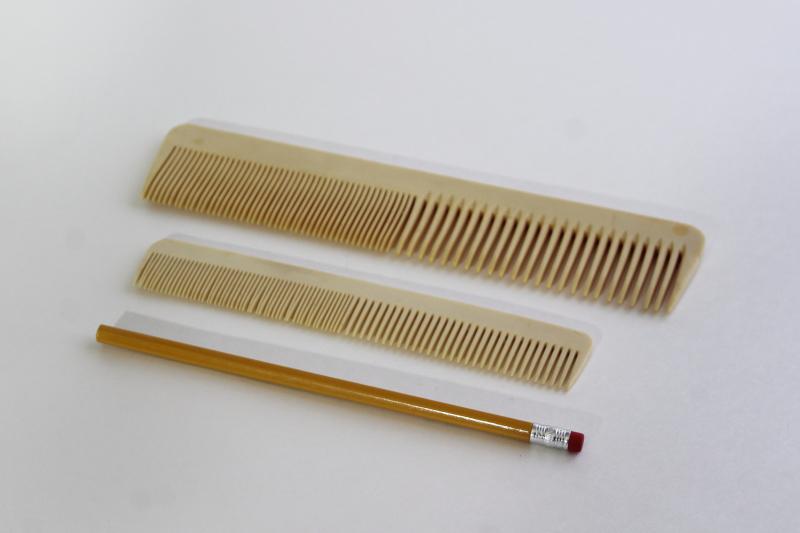 photo of 1920s vintage french ivory celluloid combs from a vanity set, antique hair combs #1