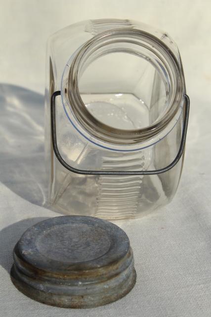 photo of 1930s vintage kitchen canister, old glass candy jar w/ wire bail handle, zinc lid #9