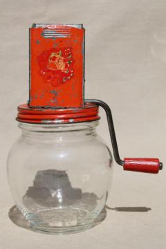 catalog photo of 1930s vintage nut grinder, old red paint metal hand crank nut crusher w/ glass jar