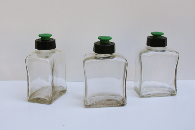 photo of 1930s vintage pharmacy bottles, Squibb green and black bakelite lids art deco glass bottle lot #1