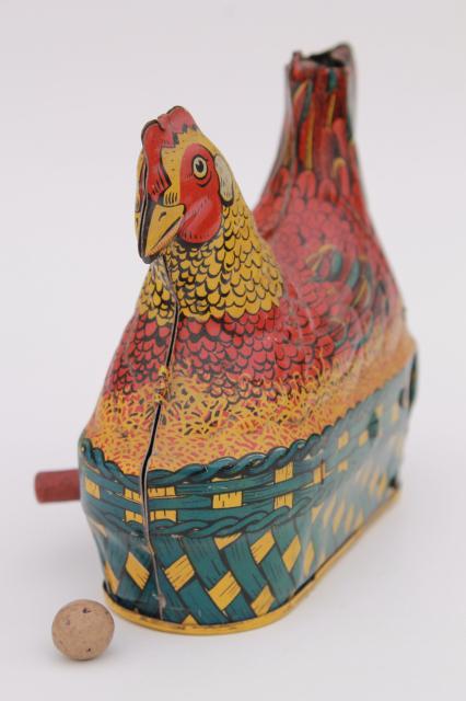 photo of 1930s vintage tin toy laying hen, metal litho print chicken on nest w/ egg #5