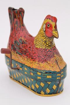 catalog photo of 1930s vintage tin toy laying hen, metal litho print chicken on nest w/ egg